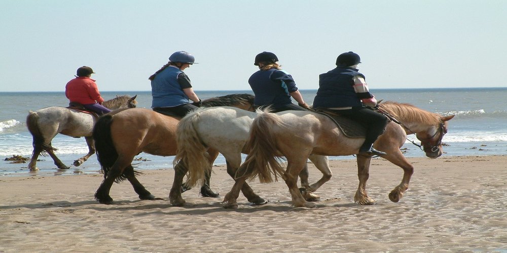 Riding on the beach